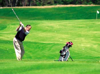A golfer practices at Bandon Dunes Golf Resort.